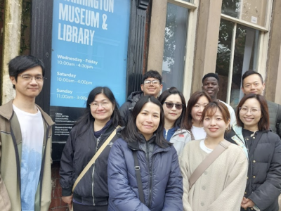 Happy students outside Warrington Museum on a visit.