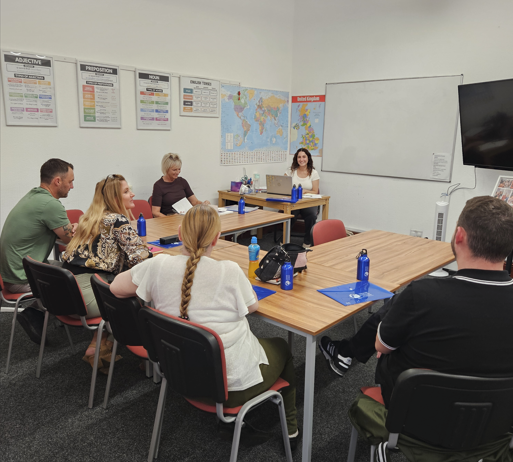 Spanish class, Learners and teacher in the classroom.